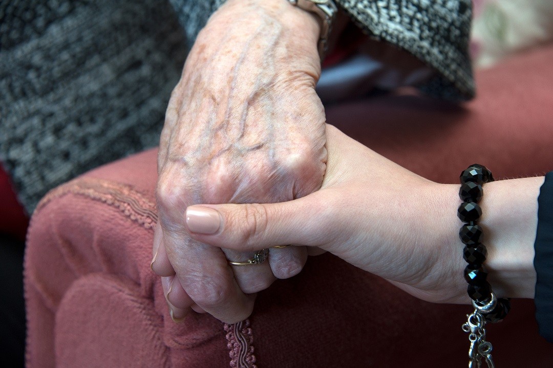 Holding hands - offering support in health and social care