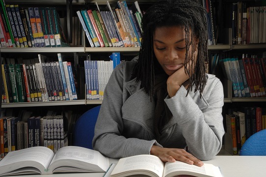 Girl Reading in the Library
