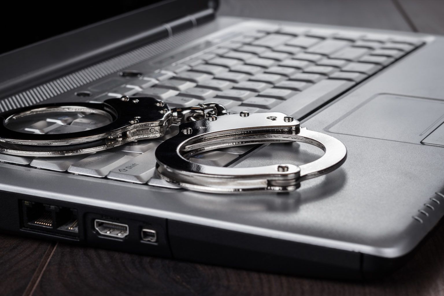 /assets/Uploads/Crime-Criminal-Justice/School-of-Law-CCJ-handcuffs-on-laptop-cyber-crime-concept-P3J7FHN-1.jpg