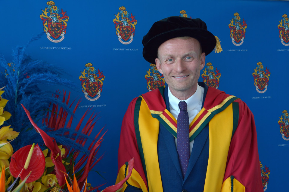 Bolton author “thrilled” as he receives Honorary Doctorate from home town University